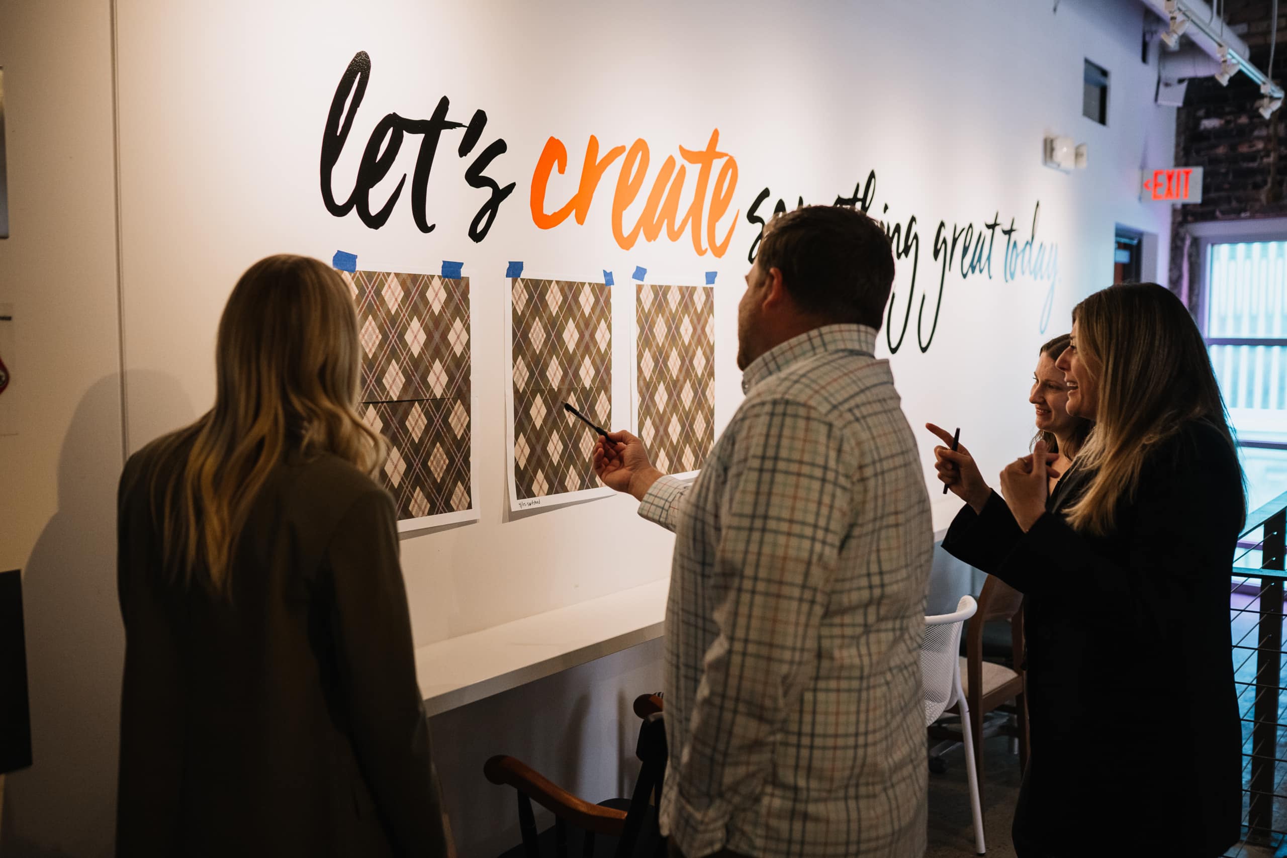 "Let's create something great today" sign